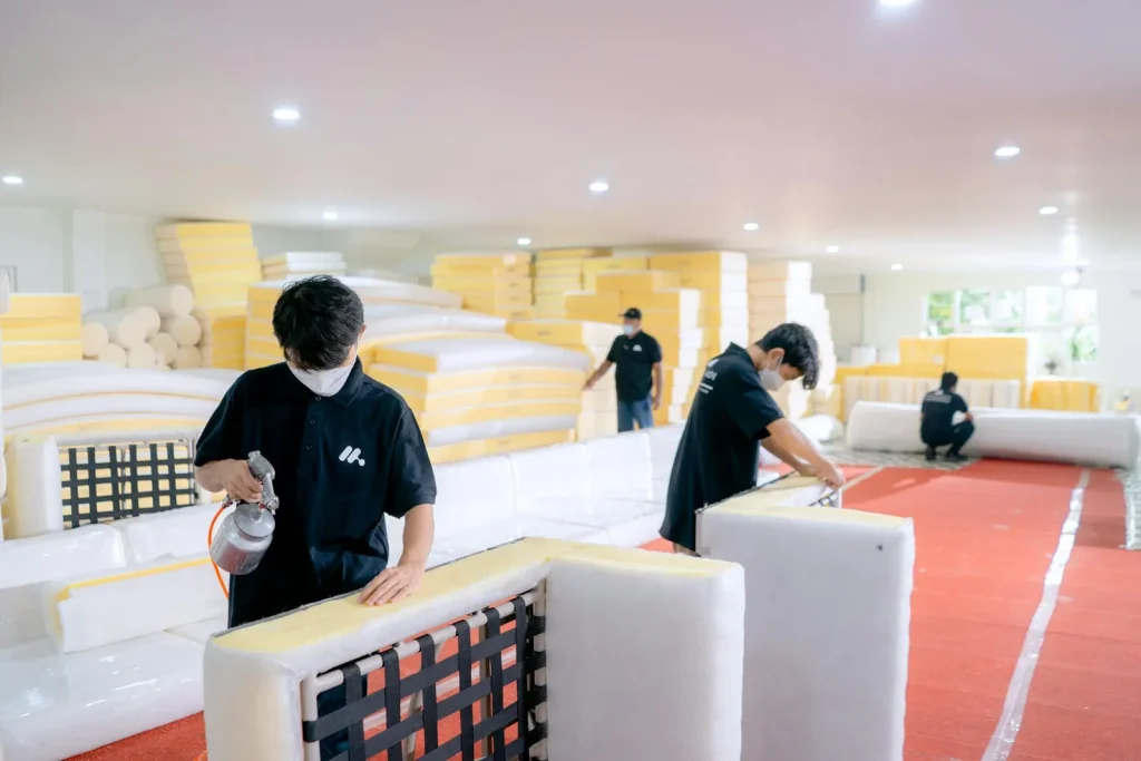 Furniture workshop scene for comparing supplier quotes before sampling