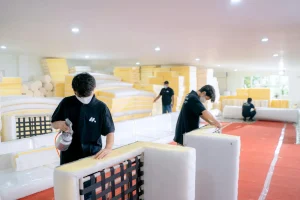 Furniture workshop scene for comparing supplier quotes before sampling