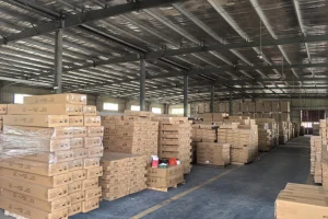 Stacked furniture panels in a workshop storage area for export batch planning