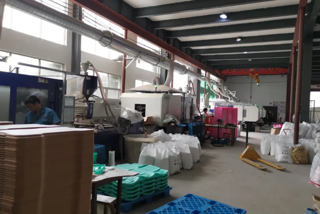 Furniture production aisle with cartons and materials prepared for export orders