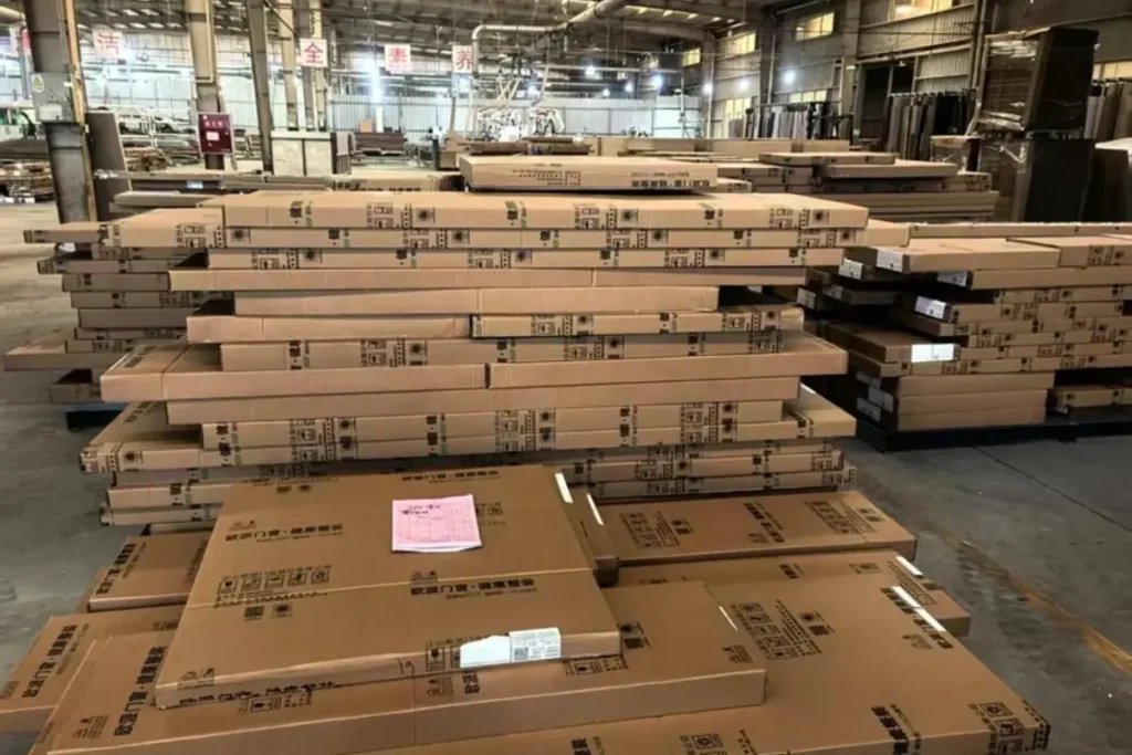 Furniture cartons and packed bedside cabinet units prepared for accessory packing, inspection, and shipment control