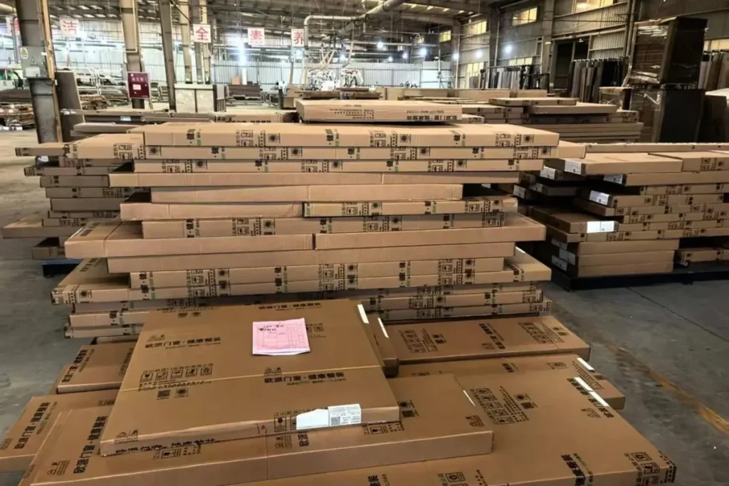 Furniture factory cartons and packed bedroom furniture prepared for batch hardware and packaging review