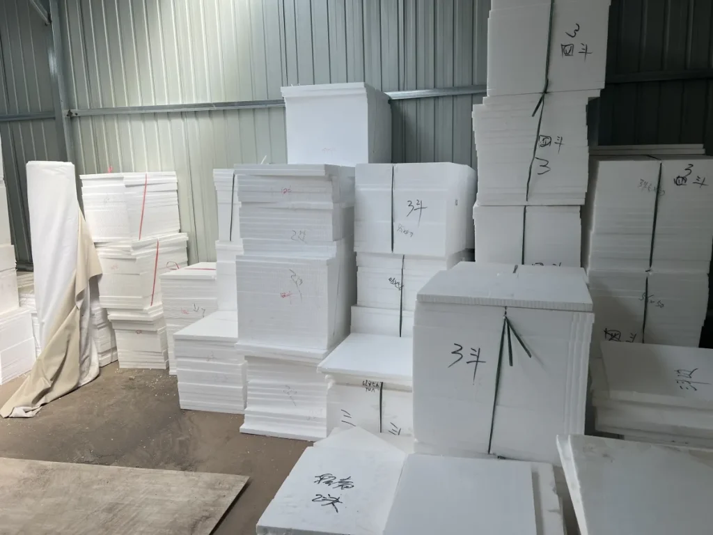 Stacks of shaped foam packing inserts for furniture